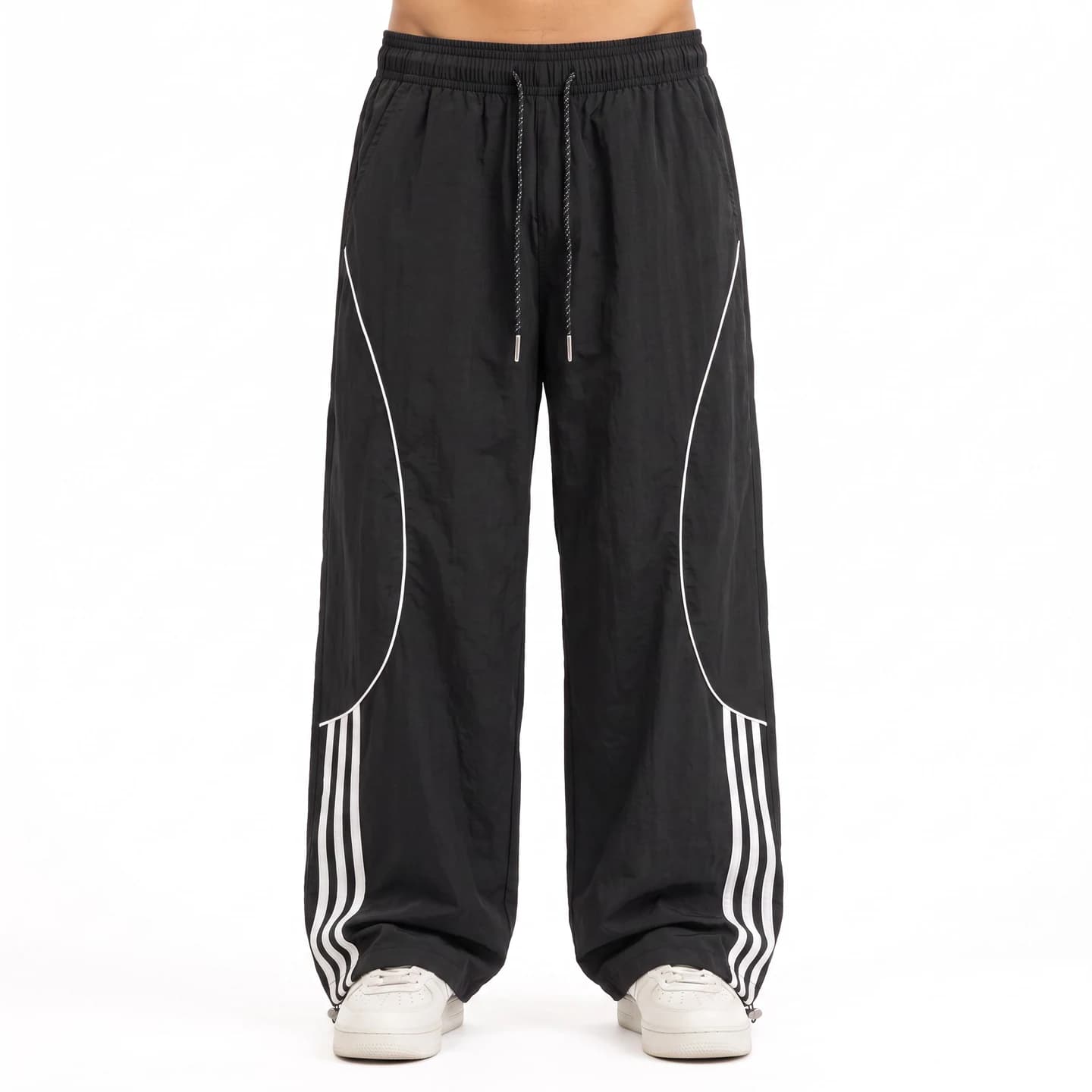 Four-Stripe Track Pants in Black, relaxed men's fit